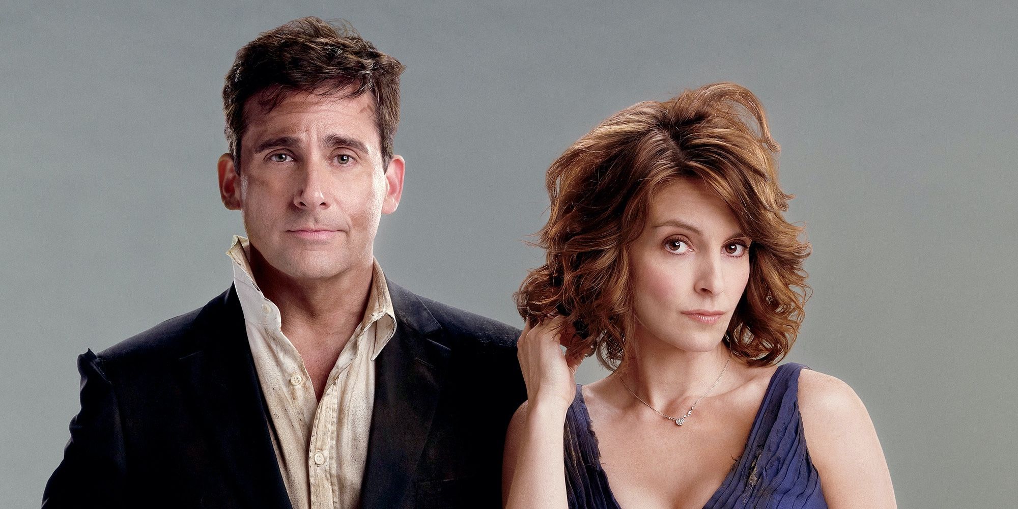 Tina Fey and Steve Carell standing side by side looking disheveled in Date Night.