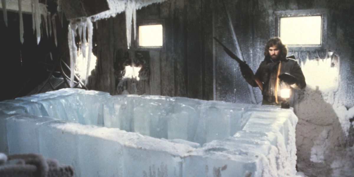 MacReady stands in front of the hollow ice block in The Thing (1982)