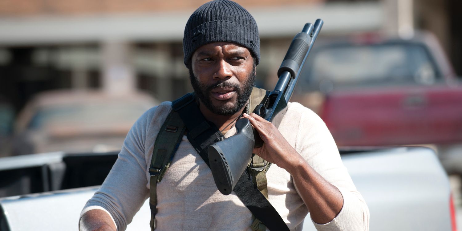 Chad L. Coleman in The Walking Dead walking with black rifle