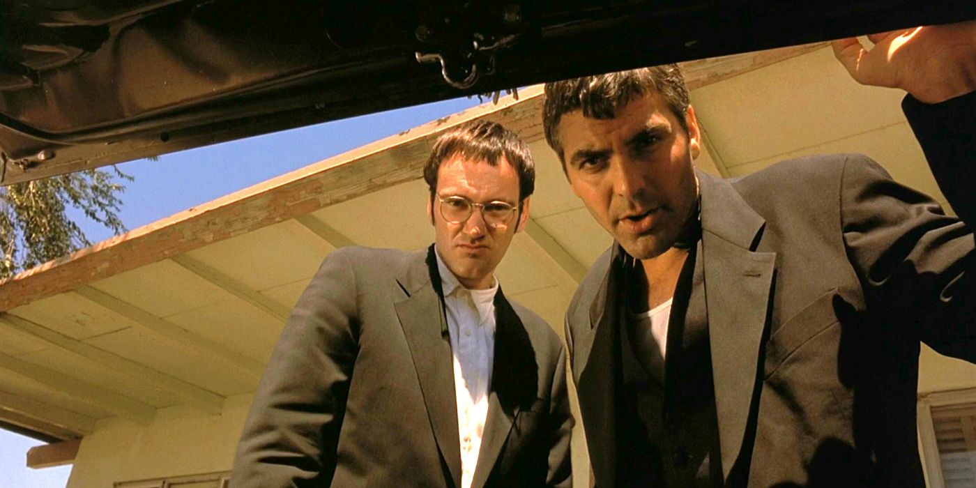 Quentin Tarantino and George Clooney look into a car trunk in From Dusk Till Dawn