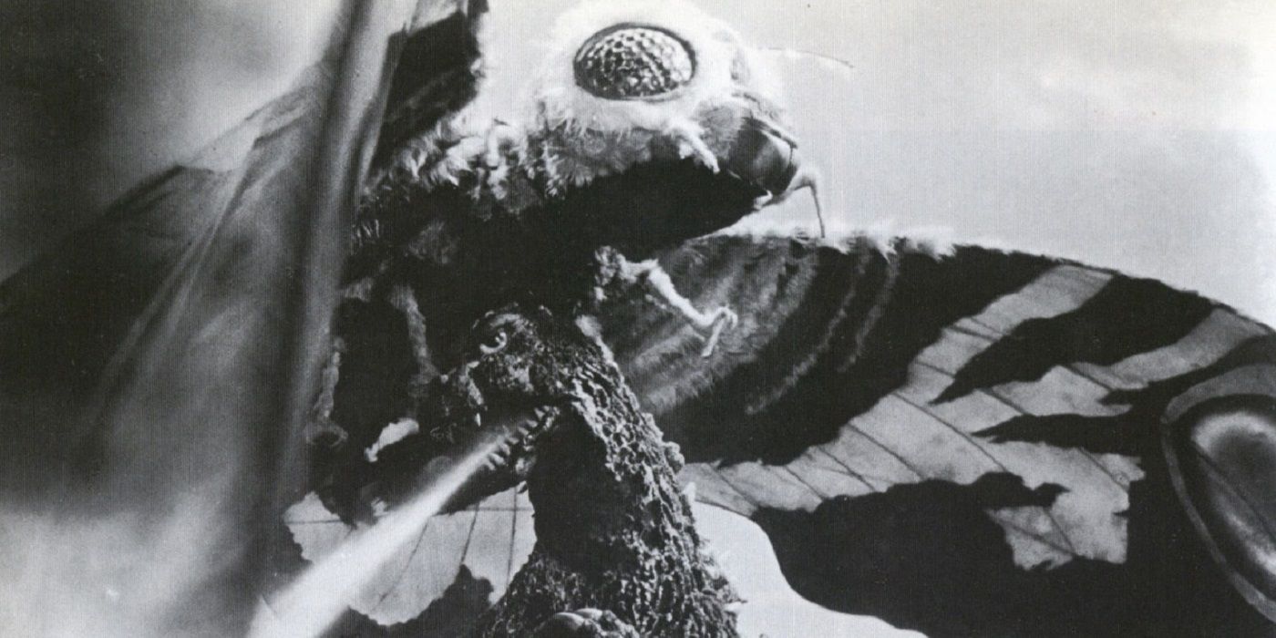 Godzilla using radioactive breath on Mothra