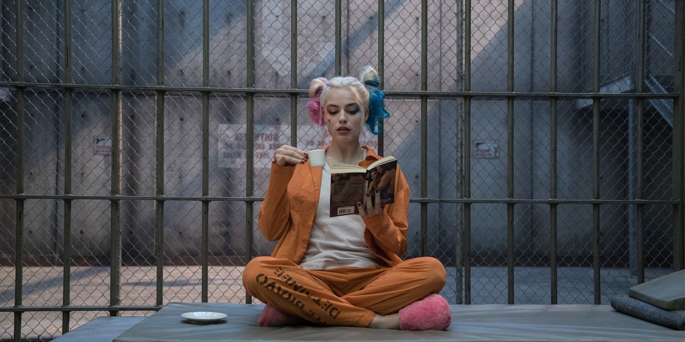 Harley Quinn reading and drinking espresso in her cell at the end of Suicide Squad
