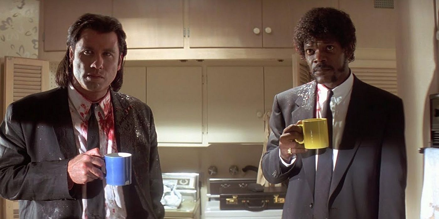 John Travolta and Samuel L. Jackson holding mugs in Pulp Fiction