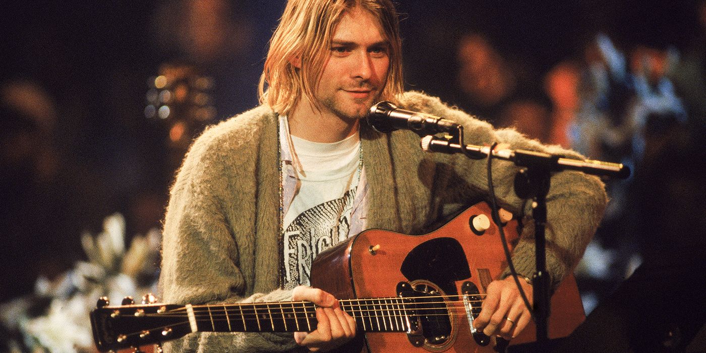 Kurt Cobain playing his guitar in MTV's Unplugged