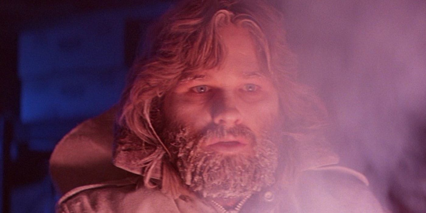 Kurt Russell looking through a cloud of smoke in The Thing.