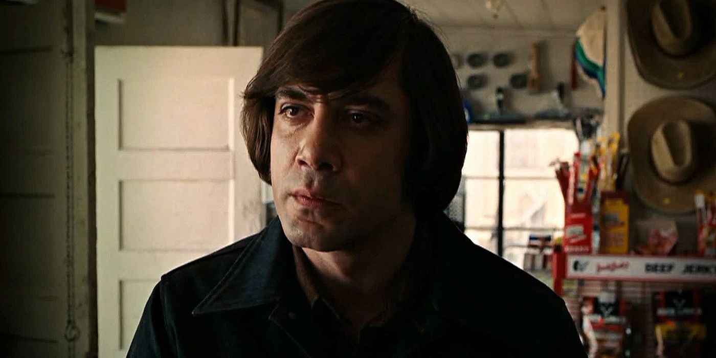 Chigurh standing at a counter in No Country For Old Men