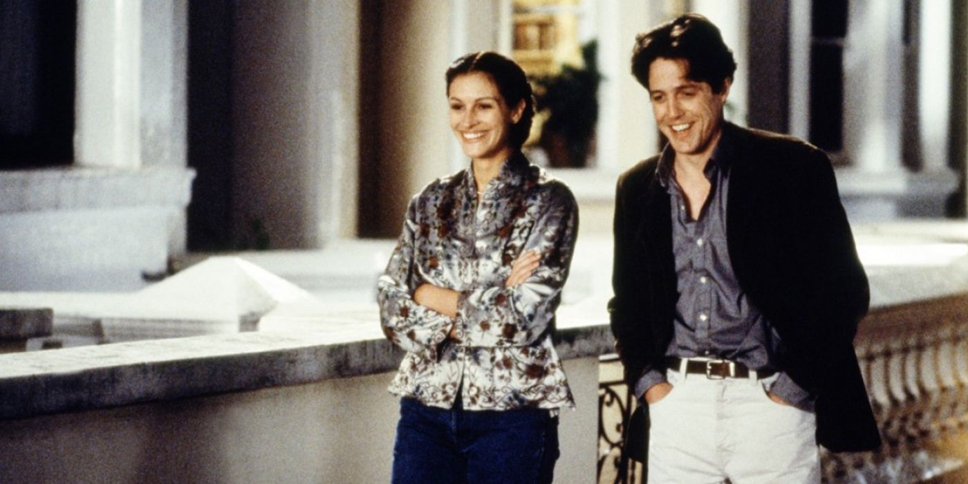 Julia Roberts and Hugh Grant laugh as they walk through London in Notting Hill