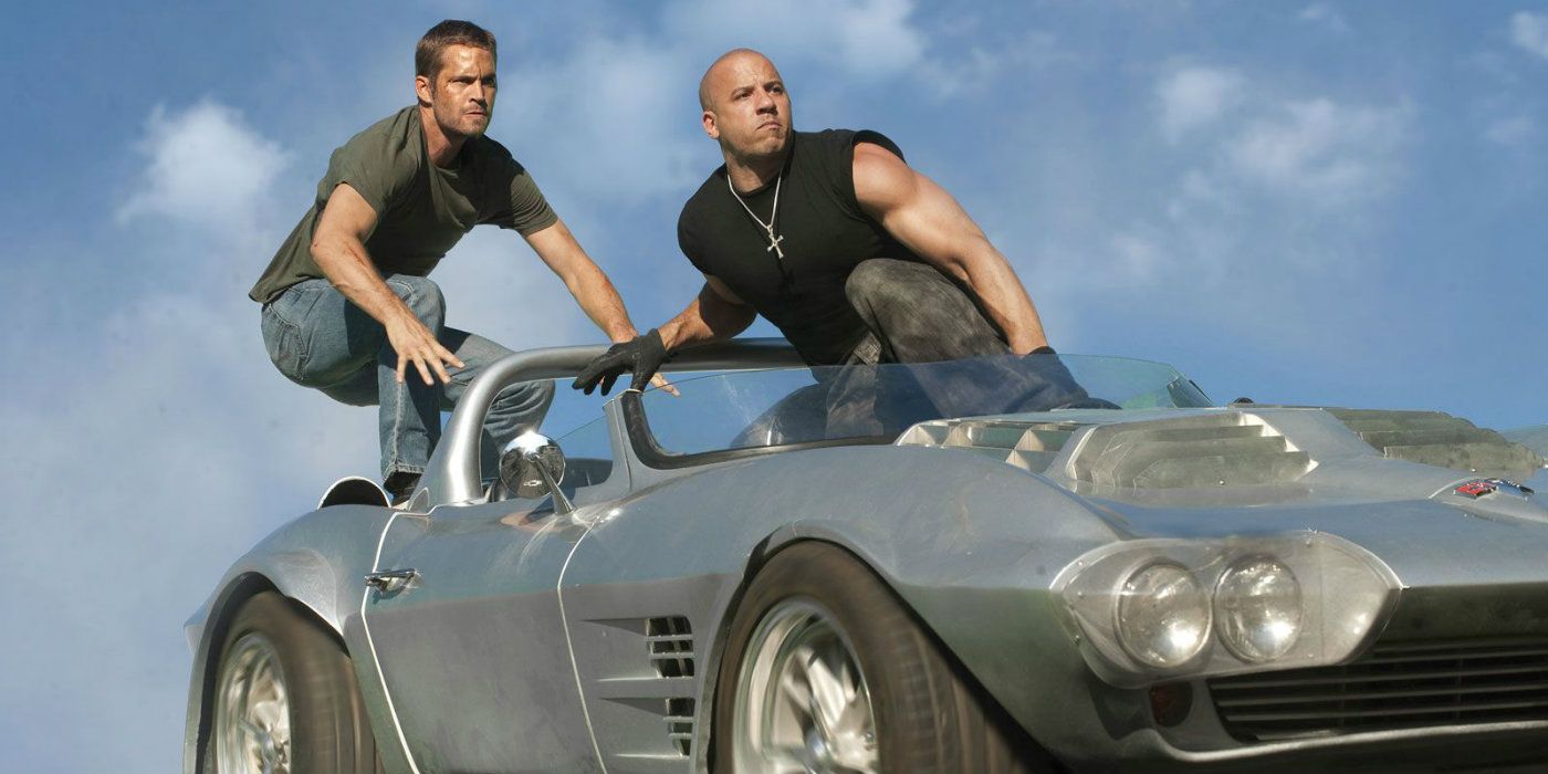 Dom and Brian stand on top of a falling car in Fast Five