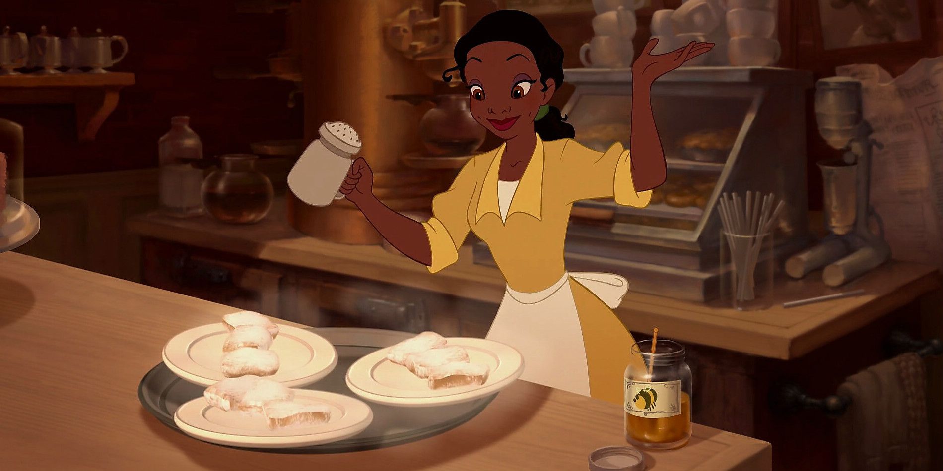 Tiana dusting beignets in Princess and the Frog