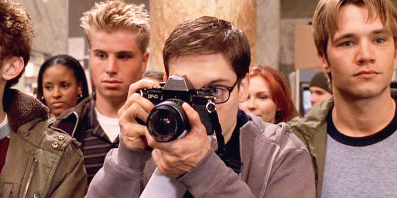 Peter Parker taking a photo in Spider-Man