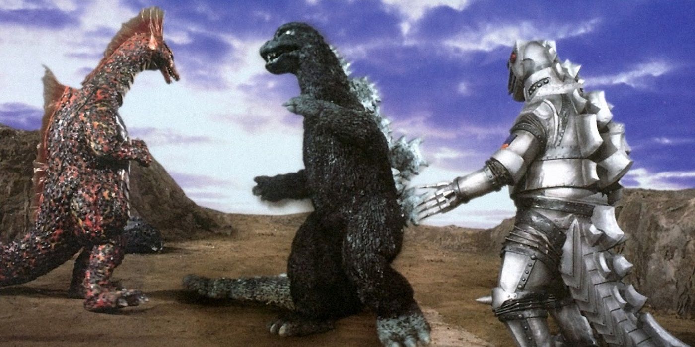 Titanosaurus, Godzilla e Mechagodzilla lutando em um terreno rochoso em Terror of Mechagodzilla