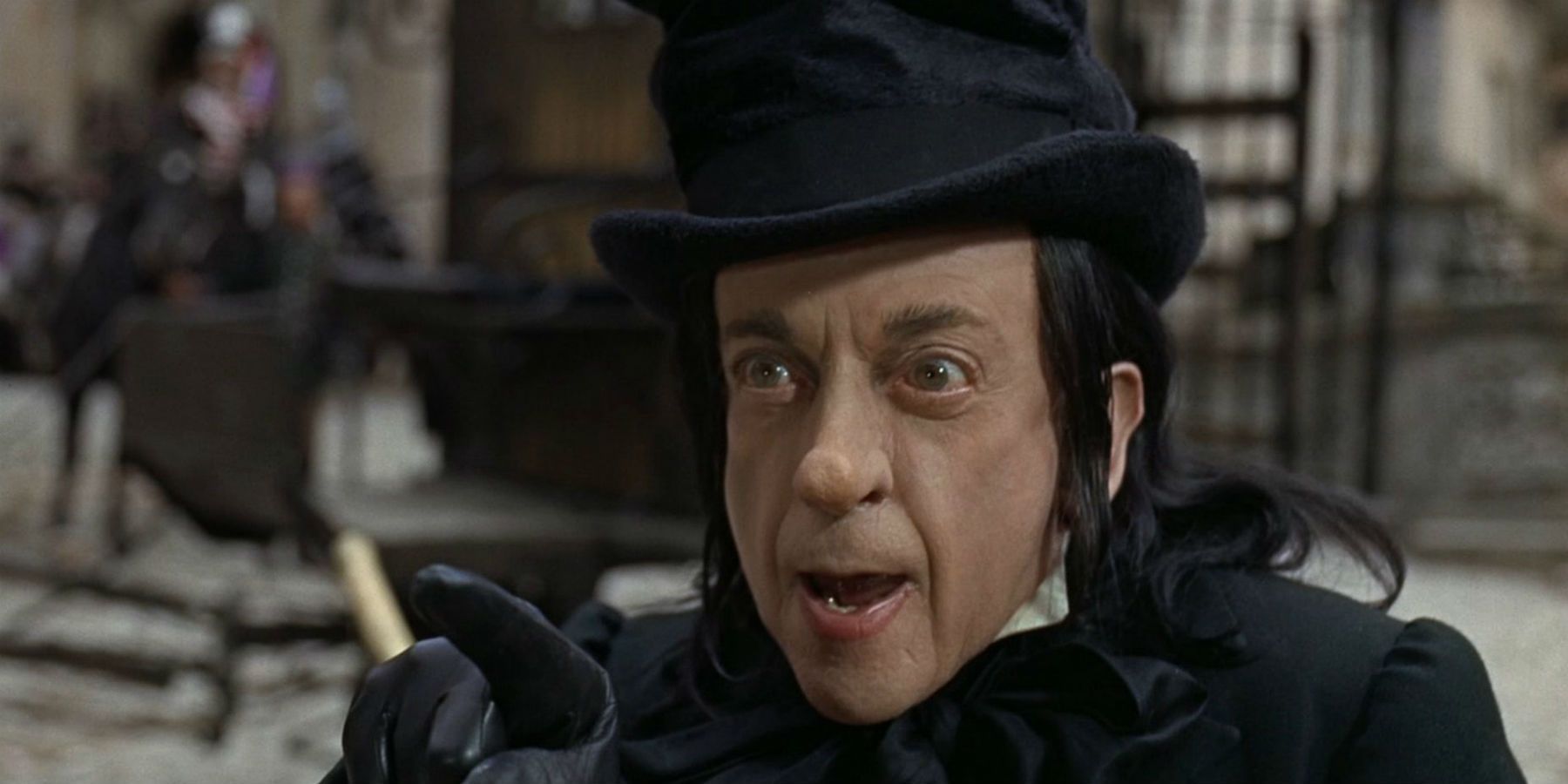 The Child Catcher dressed all in black in Chitty Chitty Bang Bang