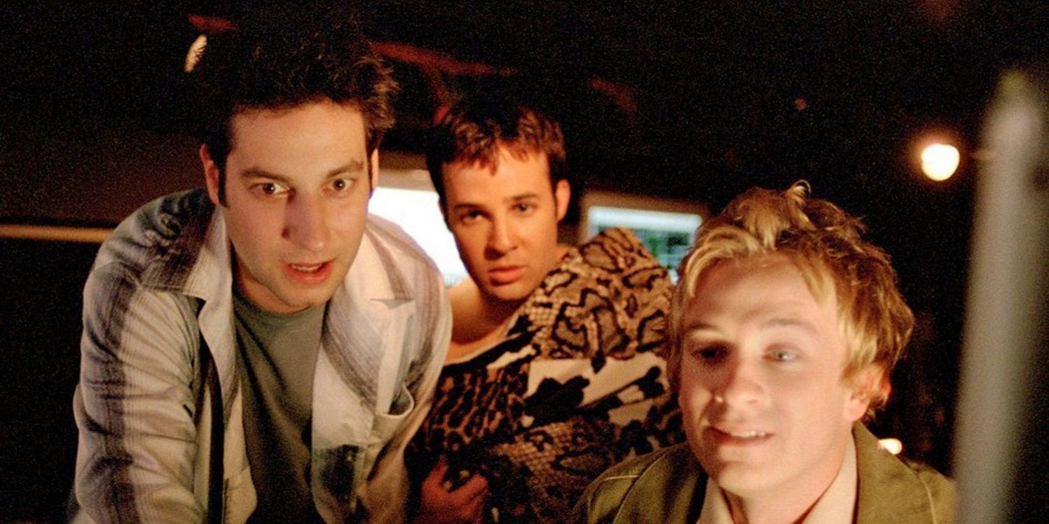 Warren, Jonathan, and Andrew looking at a computer screen in Buffy The Vampire Diaries