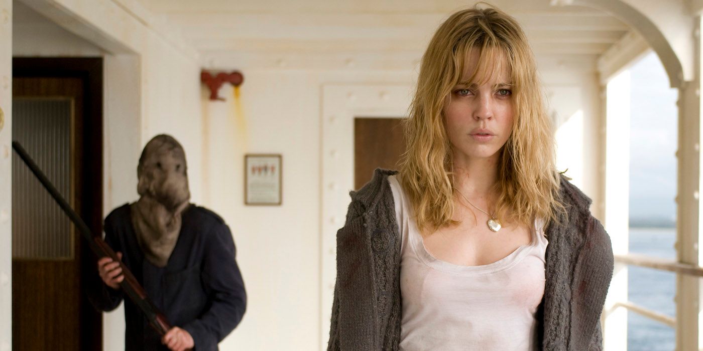 A masked serial killer behind Melissa George in Triangle (2009)