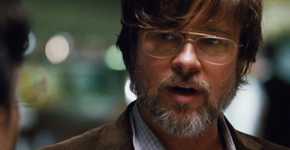 A bearded Ben Rickert (Brad Pitt) having a serious conversation with a person who's offscreen in The Big Short