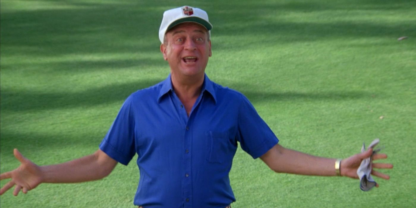Rodney Dangerfield holds his arms out in Caddyshack
