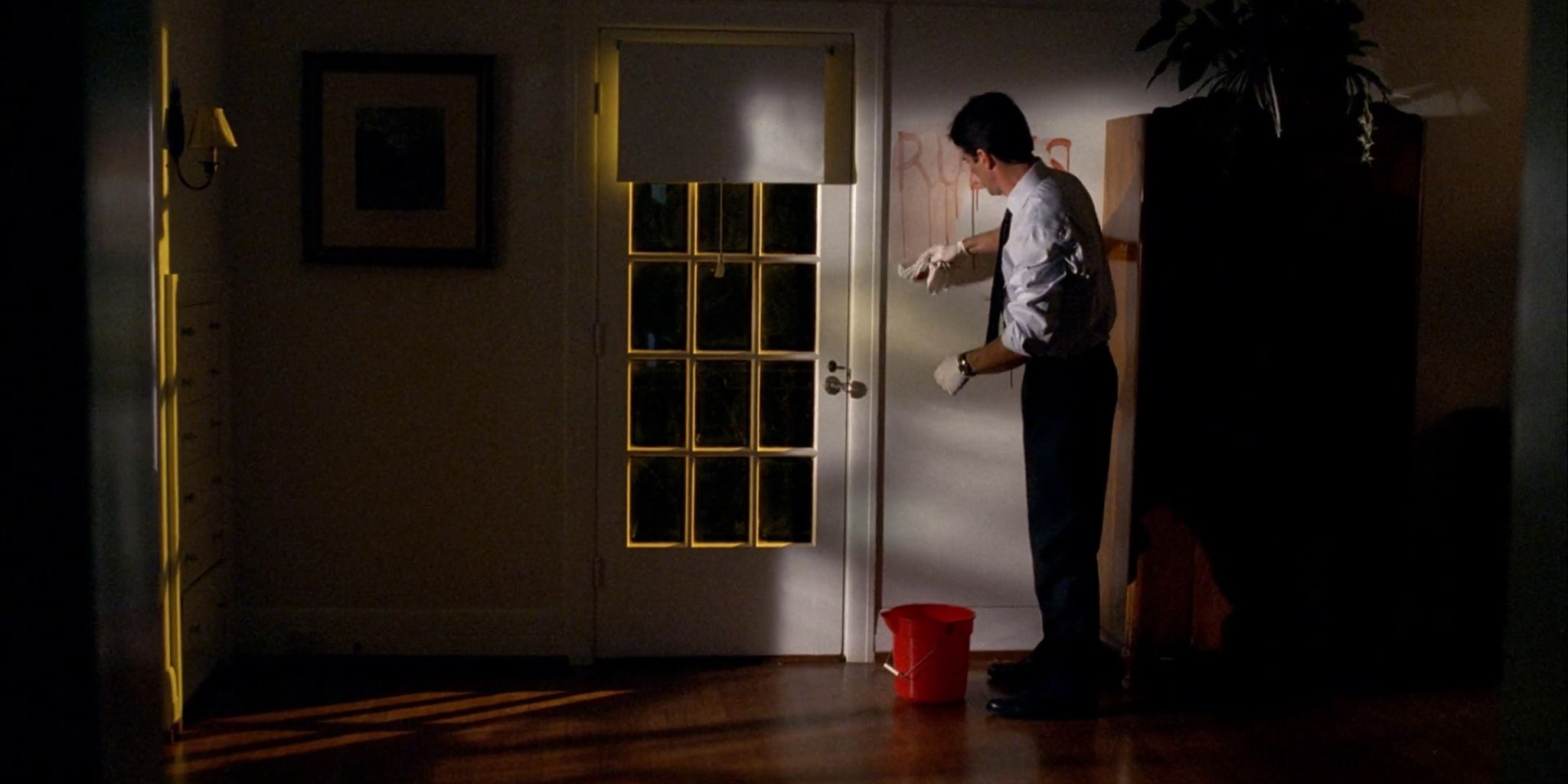 Hotch painting a wall in Criminal Minds: The Fisher King Part 2