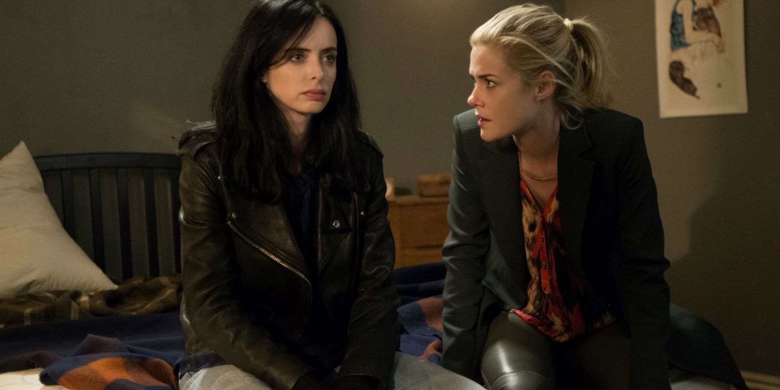 Krysten Ritter as Jessica and Rachael Taylor as Trish sit side by side in Jessica Jones