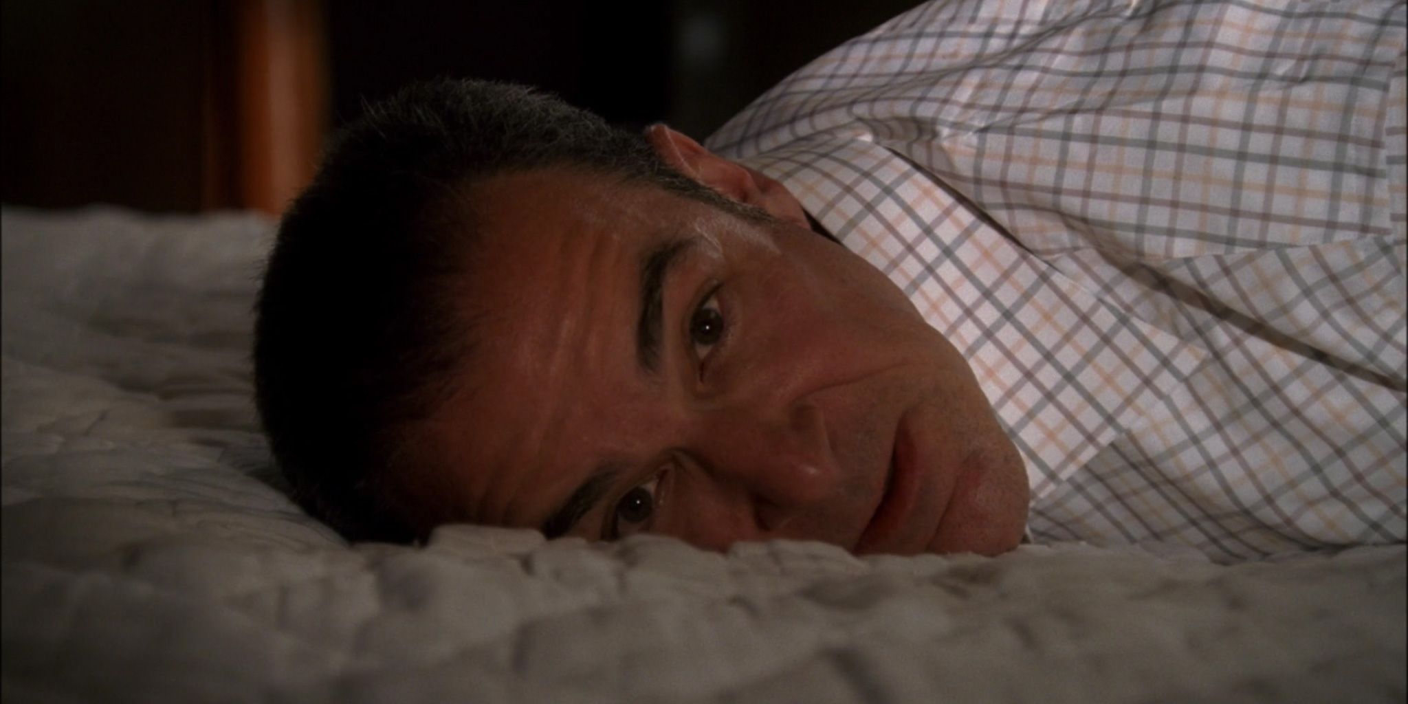 Gideon laying on his stomach in Criminal Minds: Plain Sight