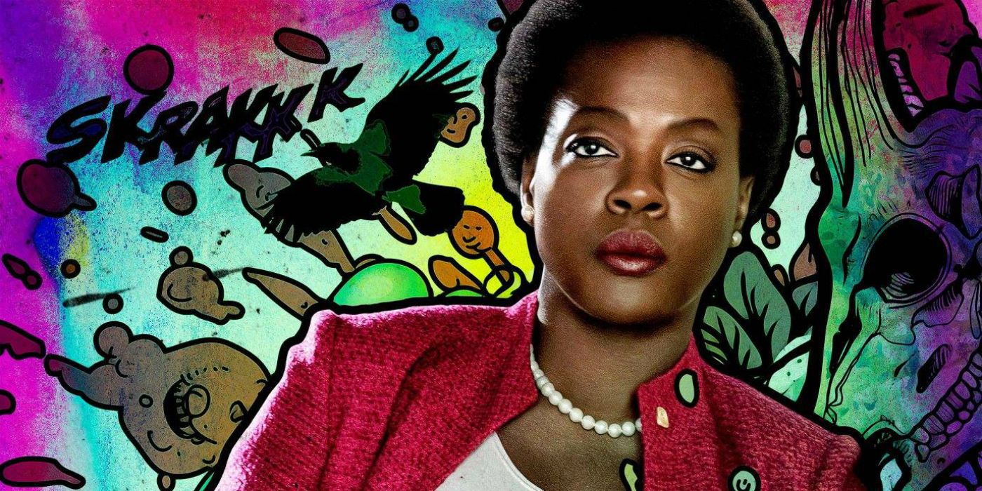 An image of Amanda Waller standing in front of graffiti