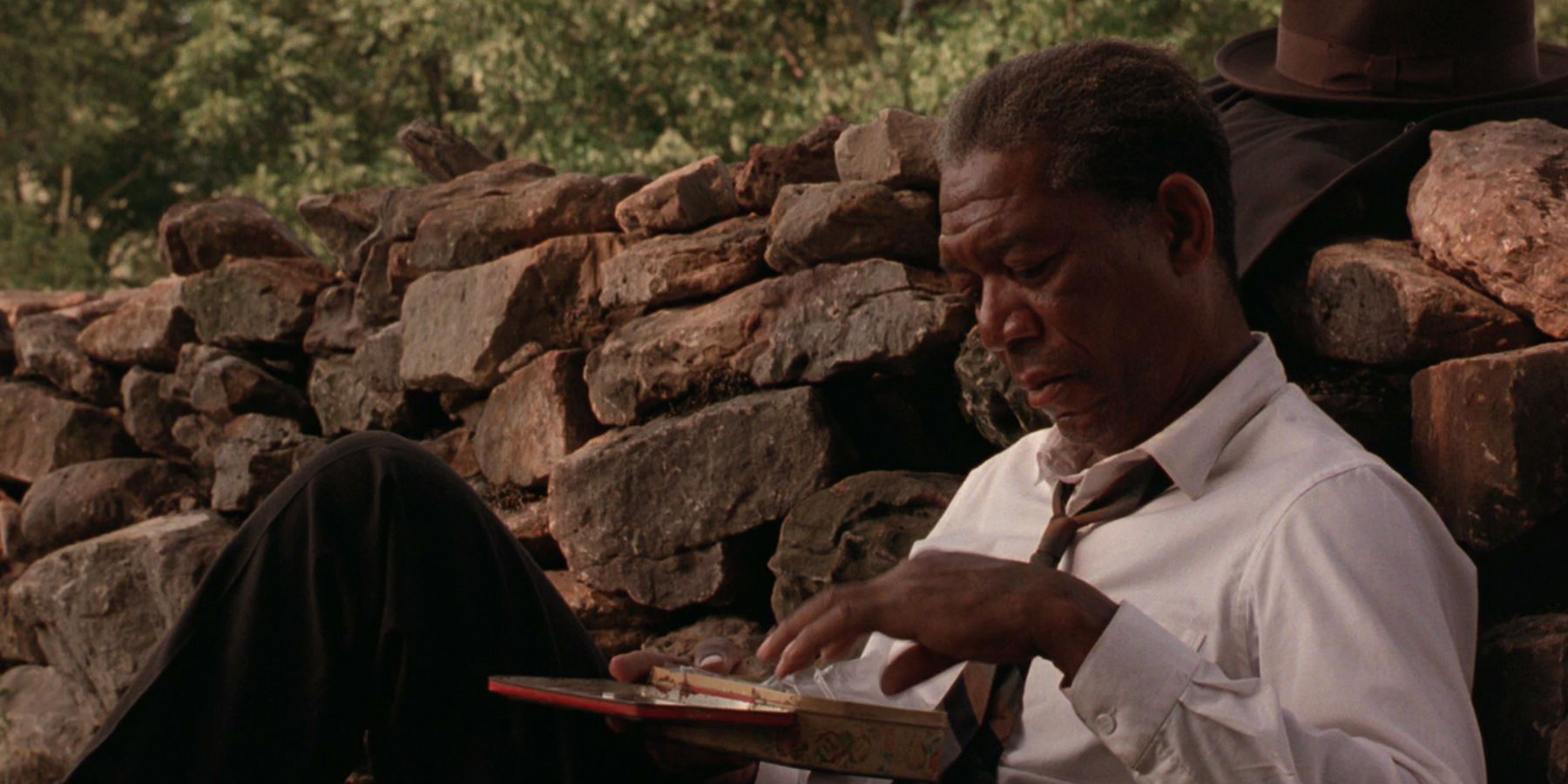 Morgan Freeman looking at a box in The Shawshank Redemption
