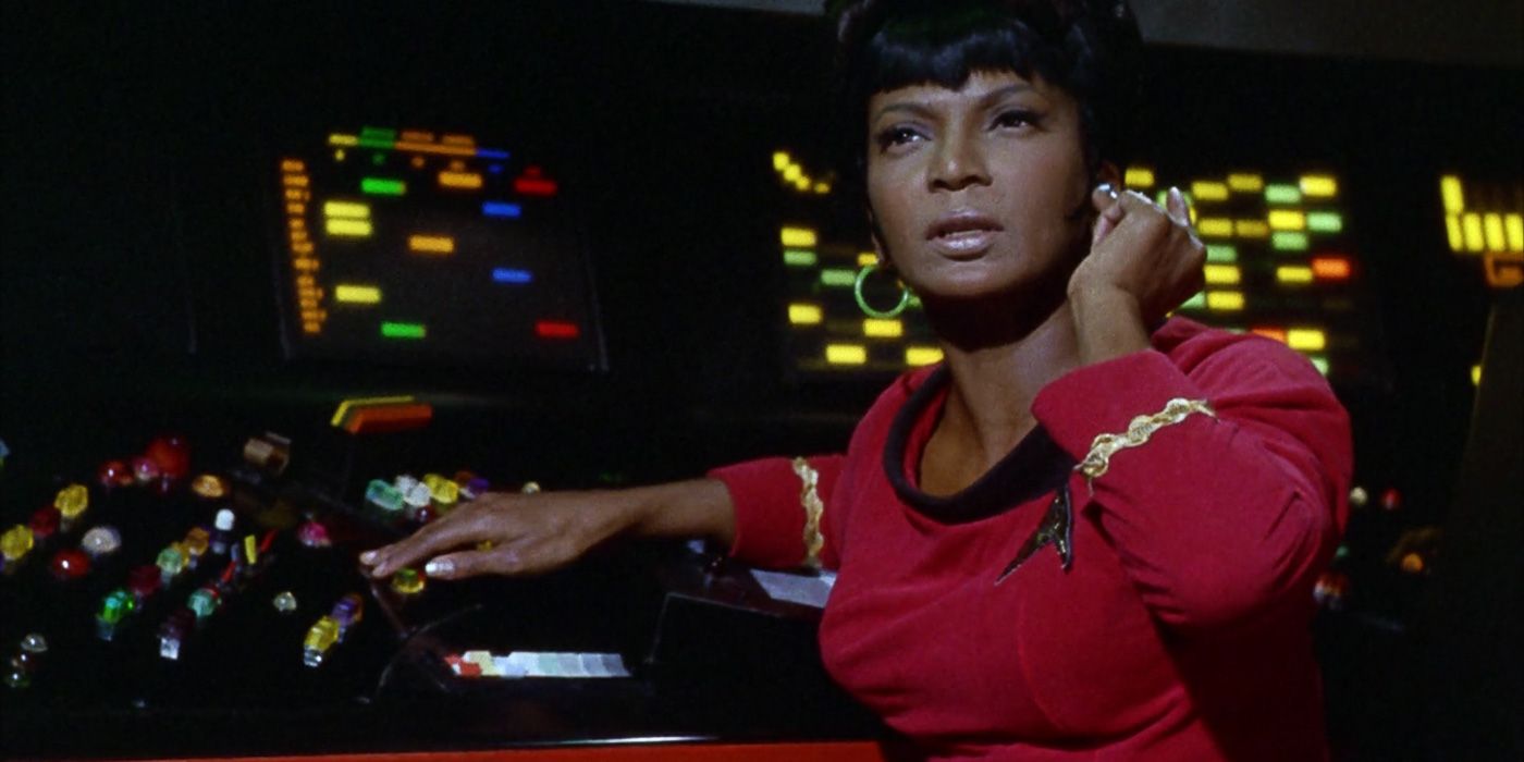 Uhura listens to a transmission in Star Trek