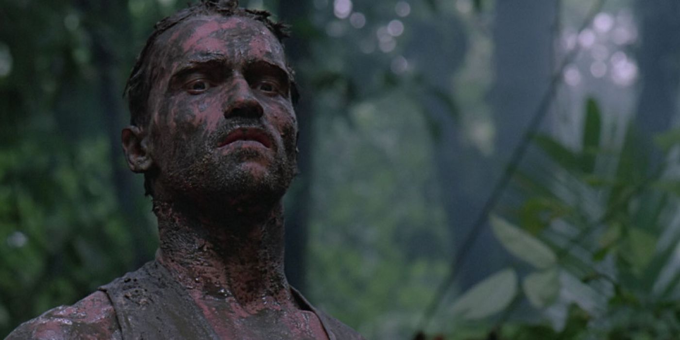 Arnold Schwarzenegger covered in mud in the jungle in Predator