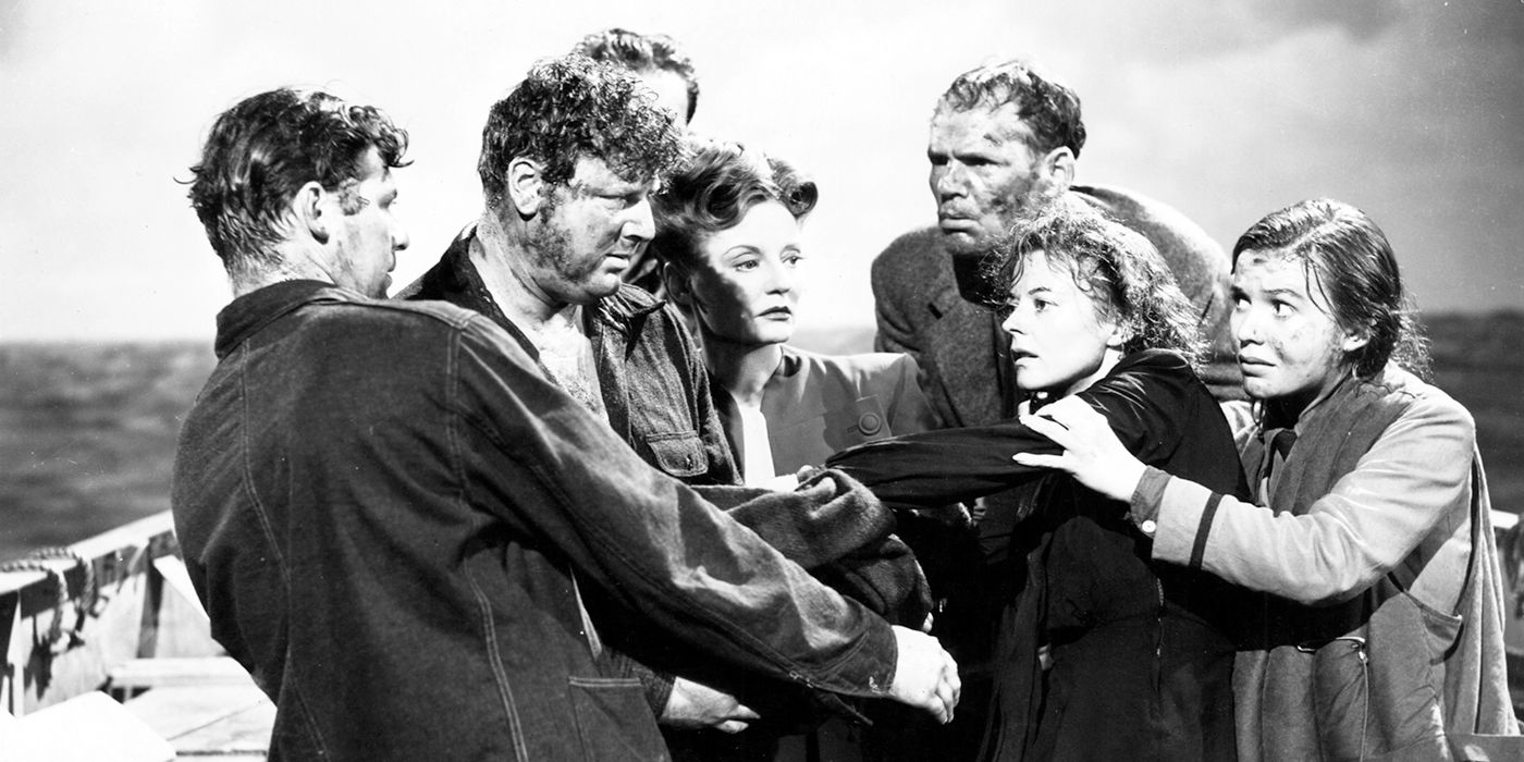 The cast of Alfred Hitchcock's Lifeboat embracing in character