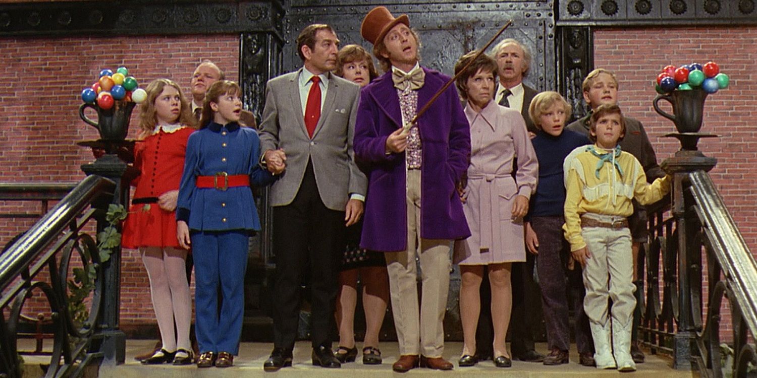 Cast of parents and children on the steps in the original Willy Wonka and the Chocolate Factory.