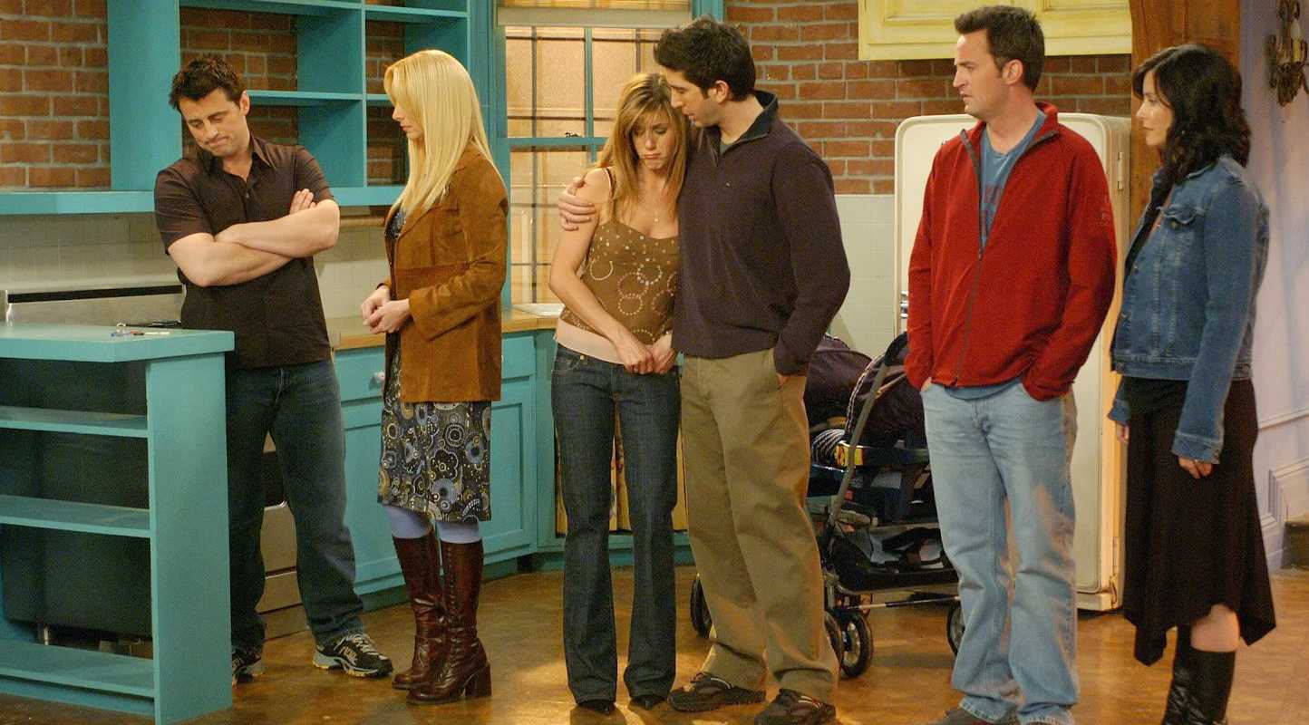 Joey, Phoebe, Rachel, Ross, Chandler, and Monica Standing in the Apartment in the Finale of Friends