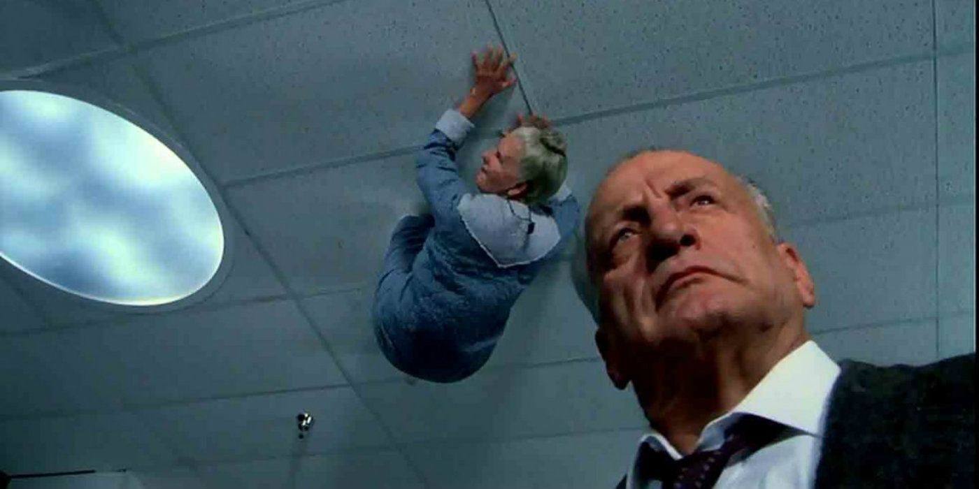 George C Scott in The Exorcist III with a woman crawling on the roof