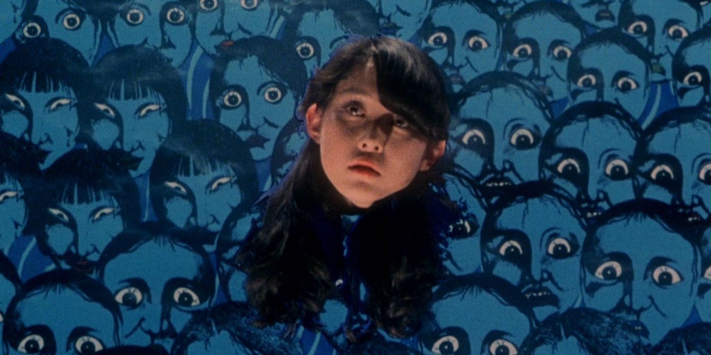 A girl's disembodied headover a group of blue cartoon faces in House
