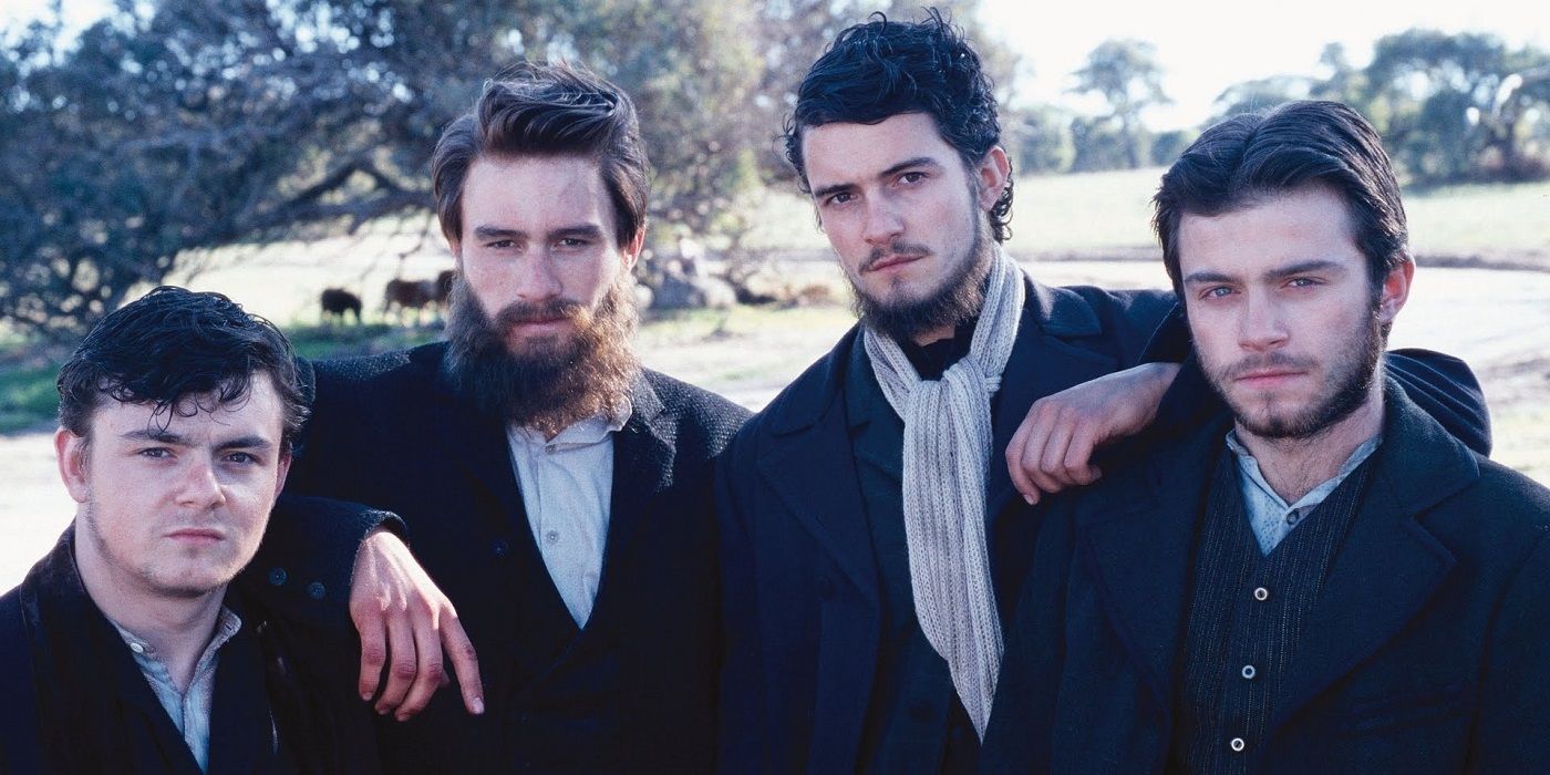 The cast of Ned Kelly in old fashioned suits.