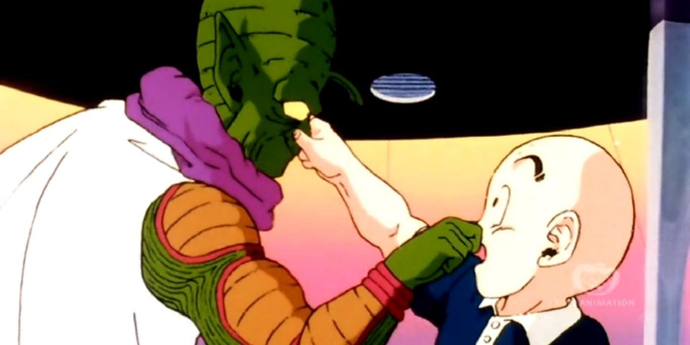 Krillin and a Namekian grab noses to greet each other