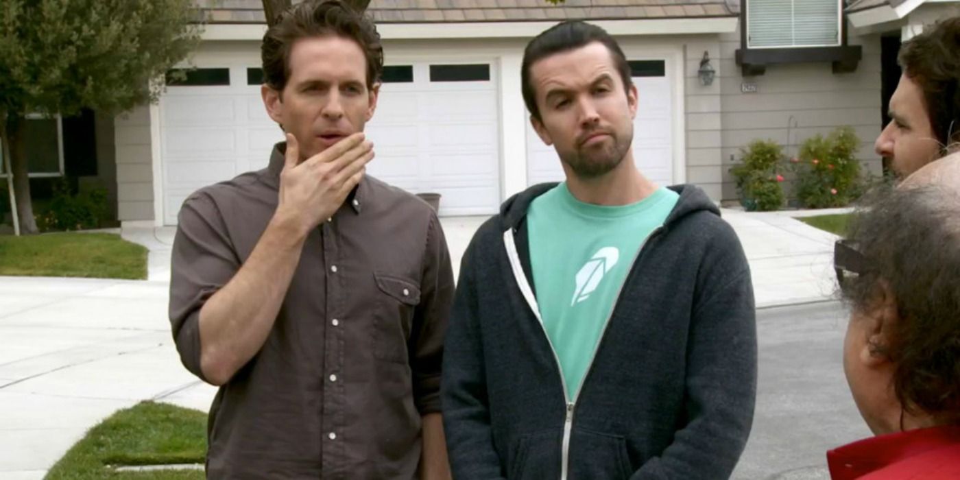 Mac and Dennis looking curious in It's Always Sunny in Philadelphia