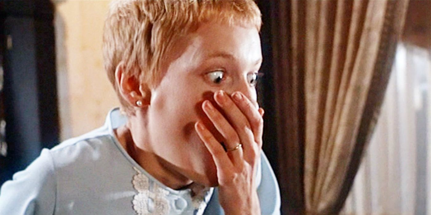 Mia Farrow in Rosemary's Baby covering her mouth in horror