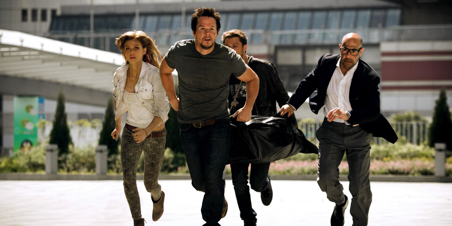 Nicola Peltz Mark Whalberg and Stanley Tuccin in Transformers Age of Extinction