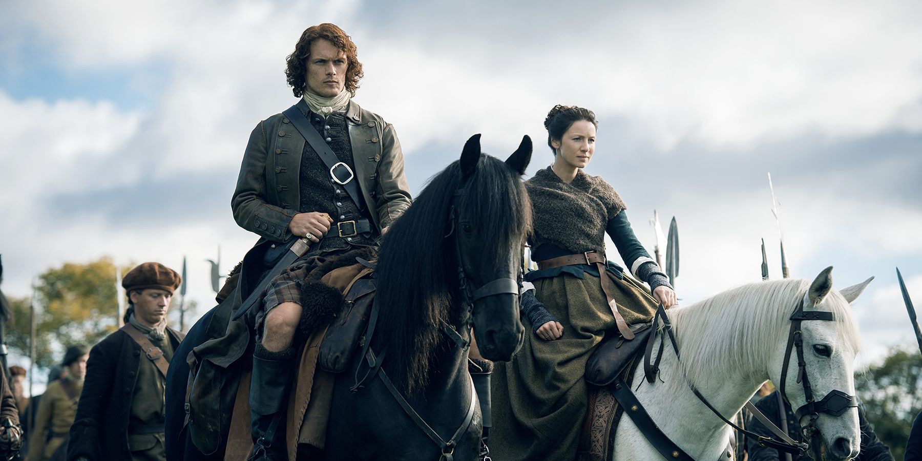 Jamie Fraser and Claire riding horses side by side.