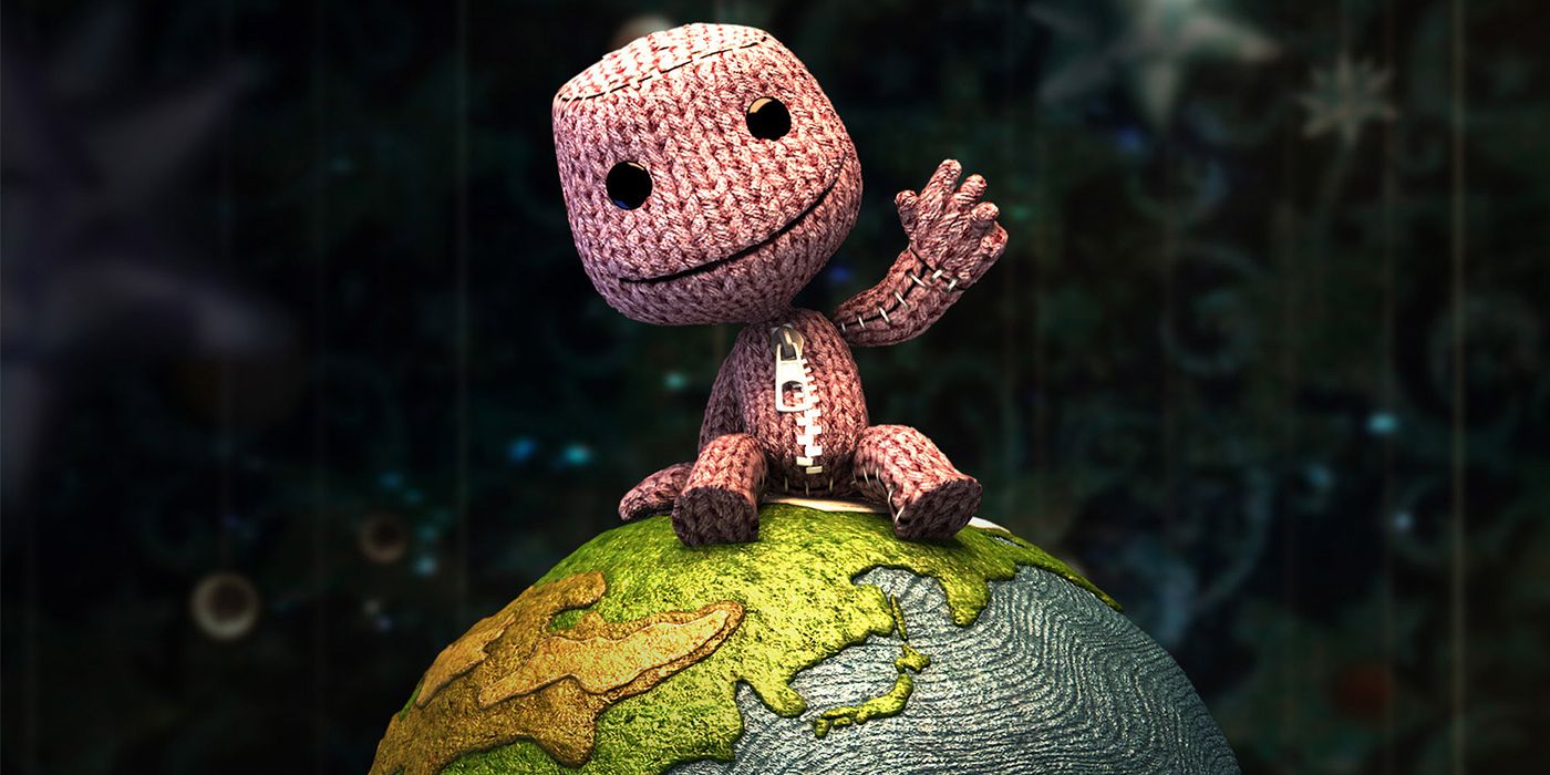 Sackboy from LittleBigPlanet waving while sitting on a globe.