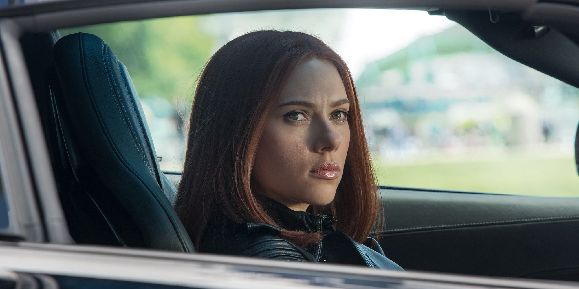 Scarlett Johansson in a car in Captain America Winter Soldier Fossil Scene