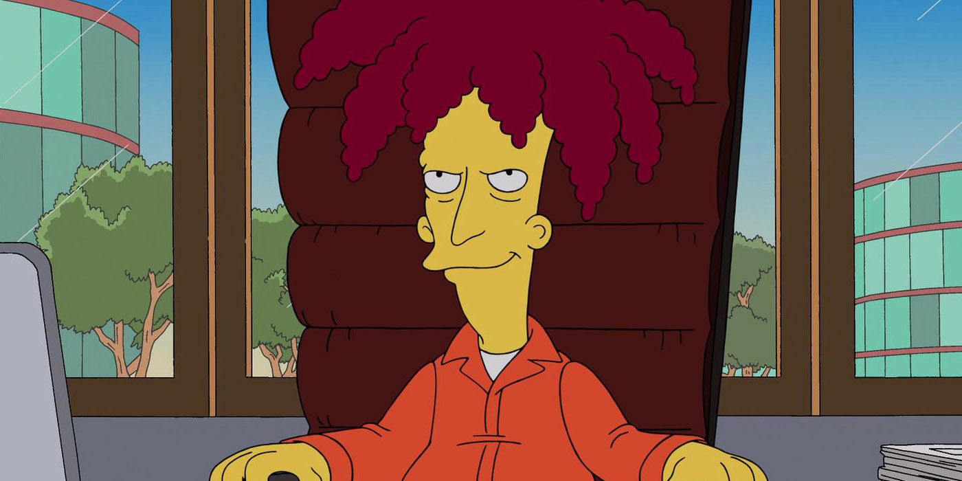 Sideshow Bob in his prison uniform sits at a brown chair in The Simpsons.
