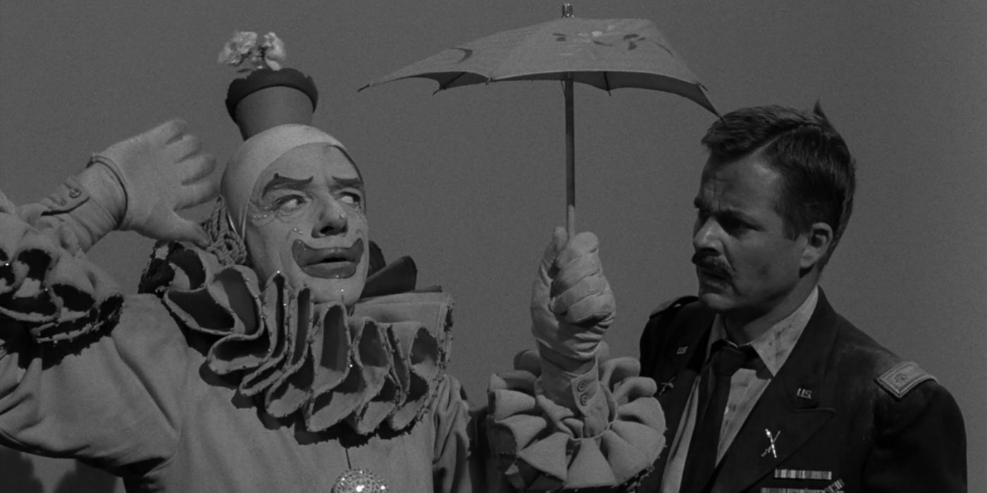 A confused man looks at a dancing clown in The Twilight Zone 