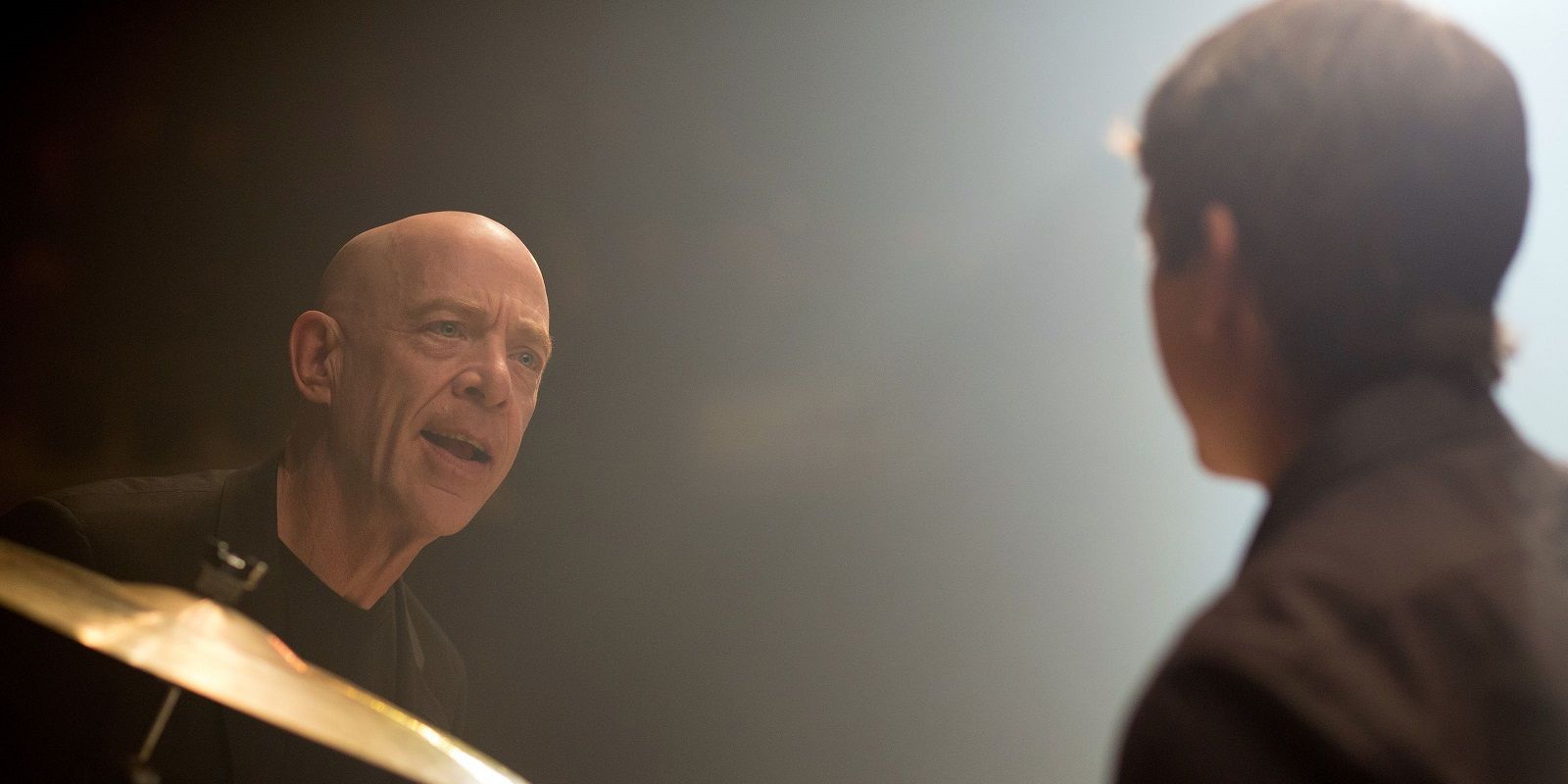 Fletcher talking to Andrew at the drum set in Whiplash