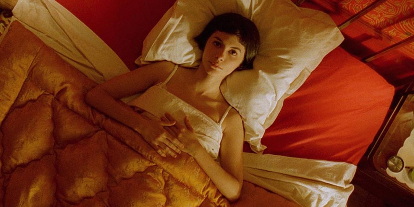 Audrey Tautou as Amelie lying in bed and staring at the ceiling.
