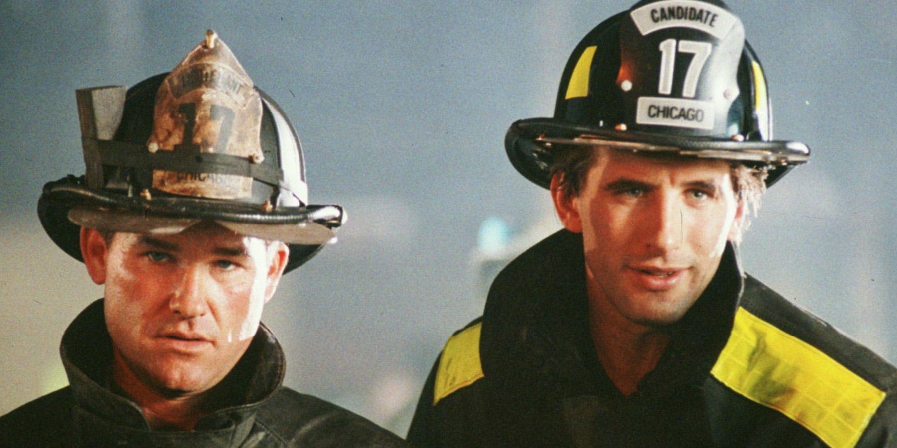 Kurt Russell and William Baldwin as firefighters looking off screen in Backdraft.