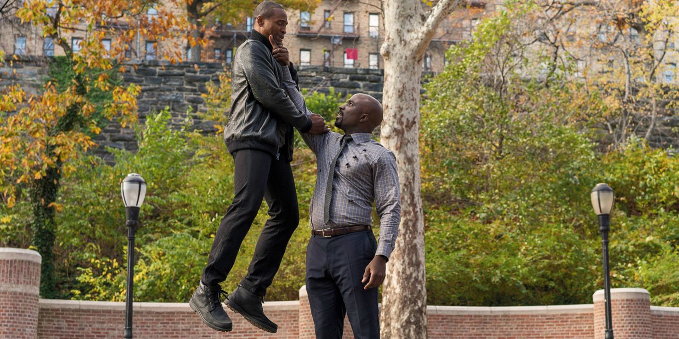 Bullet-ridden Luke Cage hoists a baddie into the air