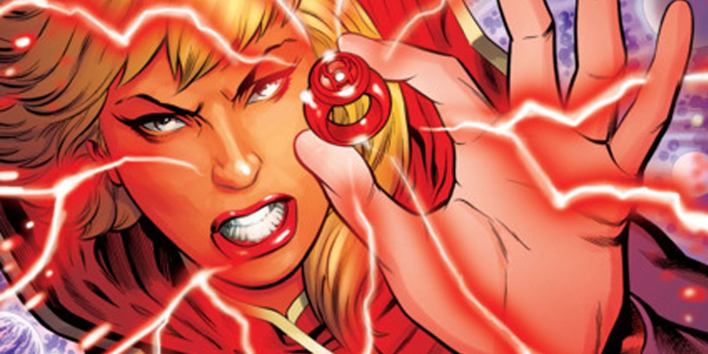 Supergirl holding up red power ring