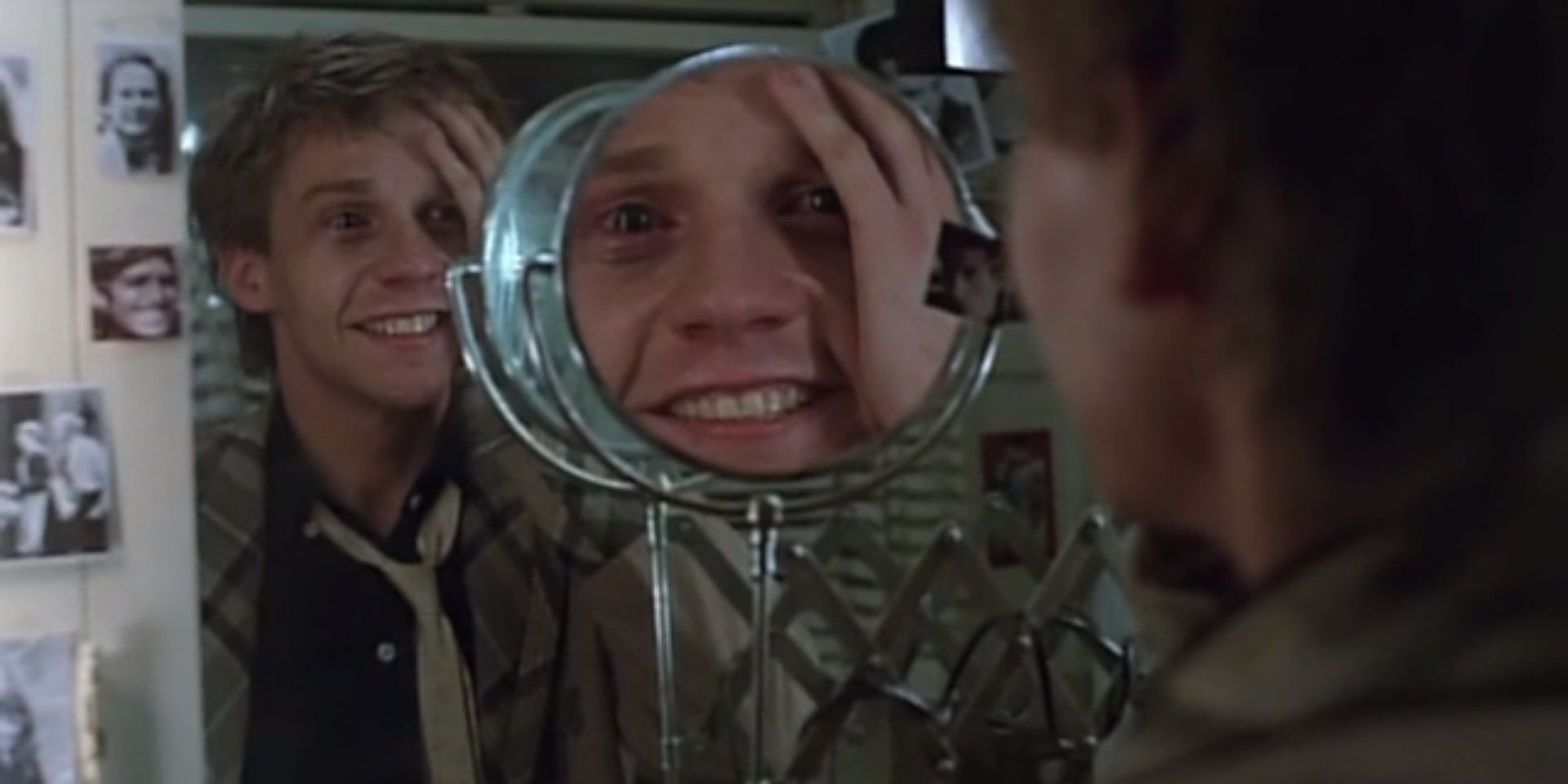 15 Underrated Horror Movies Fade to Black Eric going crazy in a mirror