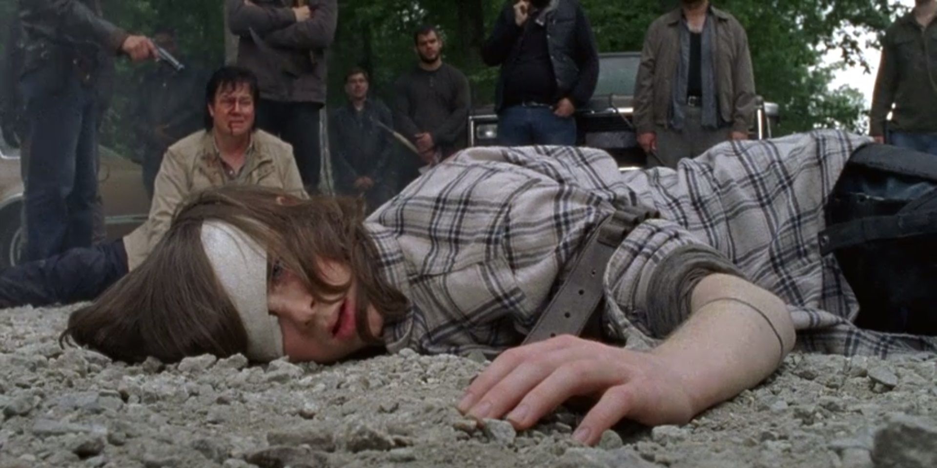 Carl Grimes is about to have his arm cut off in The Walking Dead Premiere