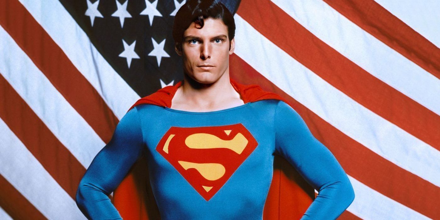Christopher Reeve as Superman in front of a flag